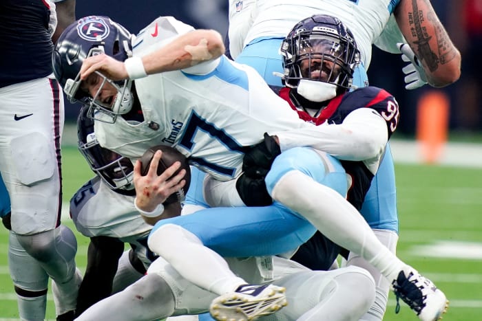 Ryan Tannehill is sacked by Houston Texans defensive end Derek Barnett (95) on a fourth down during the fourth quarter at NRG Stadium in Houston